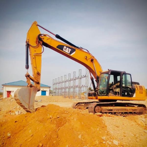 Bellevue excavator on an earthworks site beside a substation
